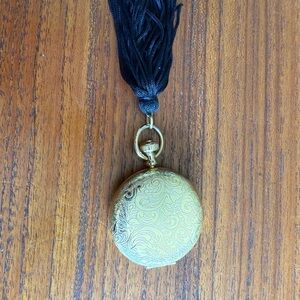 Vintage Estée Lauder makeup pocket watch compact.